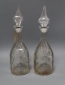 A pair of Victorian cut glass decanters