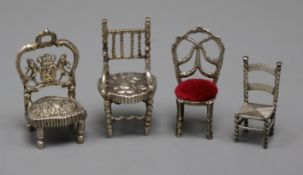 Four miniature white metal chairs including Dutch, largest 62mm.