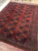 A late 19th century Afghan red ground carpet 330 x 224cm