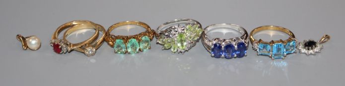 Six assorted modern 9ct gold and gem set dress rings and two small pendants.