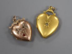 Two yellow metal and gem set heart shaped pendant lockets, one 9ct, 32mm.