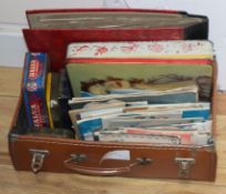 A small suitcase of ephemera and tins