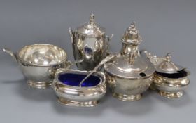 A stylish three piece silver condiment set, Birmingham, 1934 and one other three piece silver