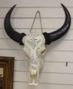 A South East Asian carved Buffalo skull with horns