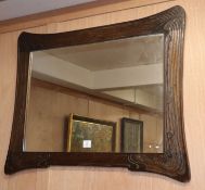 An Art Nouveau carved wood wall mirror W.99cm