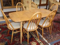 An Ercol dining table and chairs, and a sideboard 150cm, 155cm