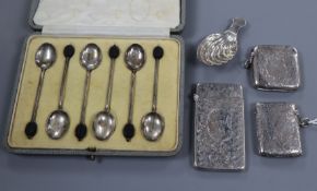 A silver caddy spoon, a silver card case, two silver vesta and a cased set of six silver bean end