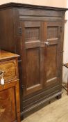An oak hall cupboard, retailed by Gillows W.112cm
