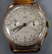 A gentleman's 1950's? 750 yellow metal Swiss Olor chronograph manual wind wrist watch, on associated