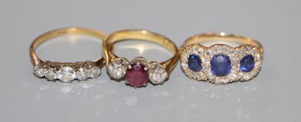 An 18ct, ruby and diamond three stone ring, an 18ct and five stone diamond ring and a yellow