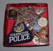 A small group of assorted badges, medals, whistle etc.