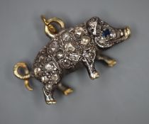 A late Victorian white and yellow metal, rose cut diamond set miniature pig pendant, with sapphire