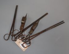Three ember tongs and two pairs of snuffers