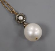 A yellow metal, rose cut diamond and cultured pearl set drop pendant, on a yellow metal chain,