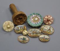 A collection of miniature glass paperweights, miniature dice, a cricket ball, two spinning tops