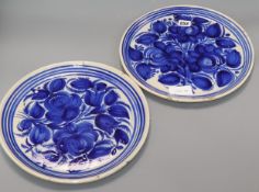 A pair of Continental tinglaze pottery dishes diameter 32cm