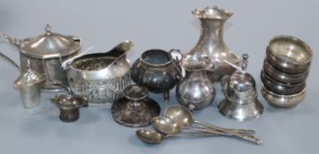An early 19th century Dutch miniature silver bell, a similar baluster cream jug and embossed cream