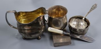 A George III silver cream jug and five other items, including a silver Christening mug, a snuff box,