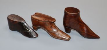 Two treen snuff shoes and a model shoe