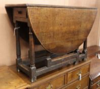 A small oak gateleg table W.102cm