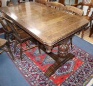 A 1930's oak draw leaf refectory table L.153cm