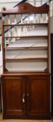 A Victorian mahogany cupboard with associated plate rack W.102cm