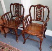 A pair of early 20th century Chinese Hongmu elbow chairs