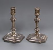 A pair of late Victorian silver tapersticks, Hawksworth, Eyre & Co, Sheffield, 1895, 10.6cm.