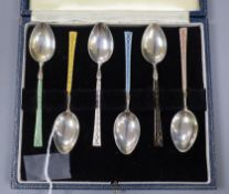 A cased set of 1950's silver and enamel coffee spoons.
