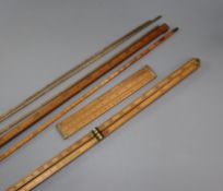 A collection of barrel dip sticks and rulers/measures