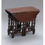 A Victorian / Edwardian walnut miniature gateleg table