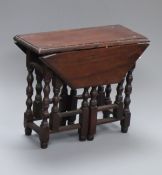 A Victorian / Edwardian walnut miniature gateleg table