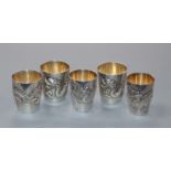 Five Chinese silver dragon cups, early 20th century, 3 by Wang Hing and two by Tuk Chang & Co.