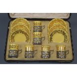 A Coalport coffee set with silver containers, cased