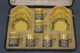 A Coalport coffee set with silver containers, cased