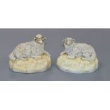 A pair of Samuel Alcock porcelain figures of recumbent sheep, c.1830-45, impressed no. 6, l. 9.