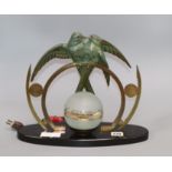 An Art Deco figural lamp, decorated with birds of paradise