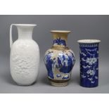 A blue and white sleeve vase, a crackleware vase and a Kaiser vase tallest 26cm