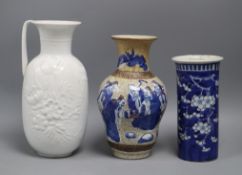 A blue and white sleeve vase, a crackleware vase and a Kaiser vase tallest 26cm