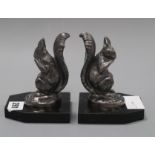 A pair of Deco squirrel bookends, signed Frecourt height 12cm