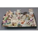 A collection of miniature ornaments, putti, Chinese sages, cats, figurines, etc.