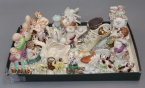 A collection of miniature ornaments, putti, Chinese sages, cats, figurines, etc.