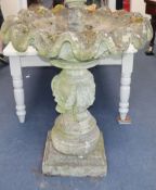 A reconstituted stone fountain in the form of a shell H.125cm approx.