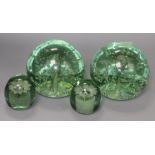 Two pairs of green glass dumps