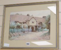 Herbert E. Butler, watercolour, Figure feeding doves beside a thatched house, signed 26 x 37cm