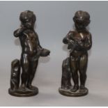 A pair of French bronze putti height 19cm