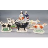 A group of cow creamers and Staffordshire