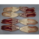 Four pairs of silver and gold coloured embroidered Turkish style slippers