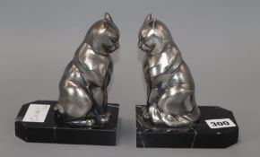 A pair of Art Deco bookends modelled as cats, signed Franjou
