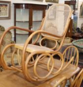 A caned bentwood rocking chair